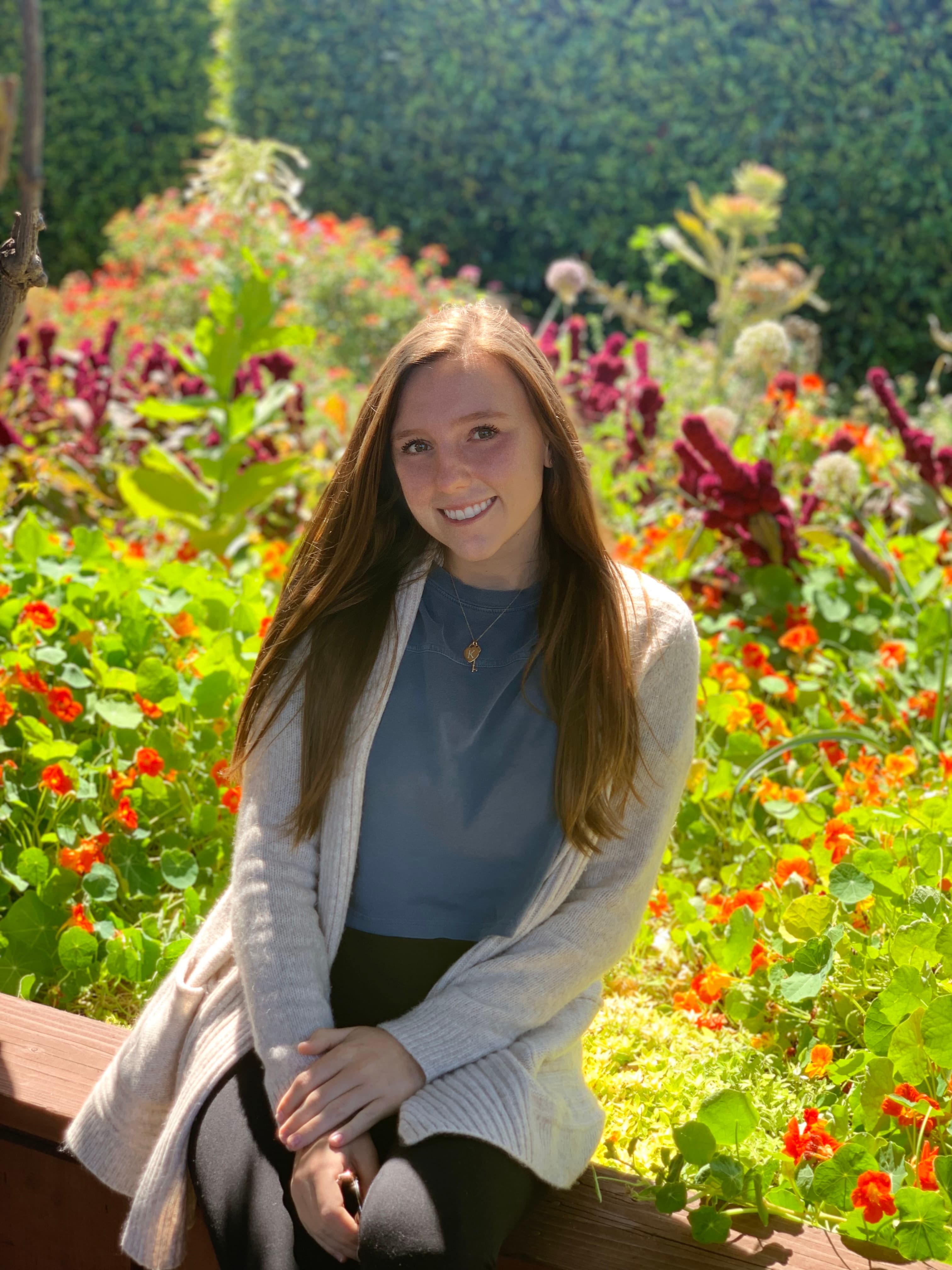Ashton Gerardi seated in a garden